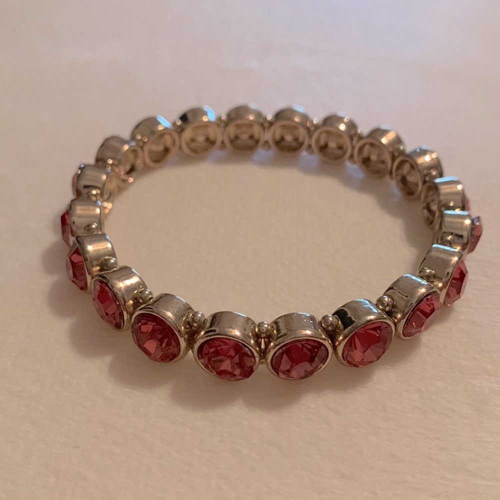 Dark pinkish/orange gold tone stretchy bracelet